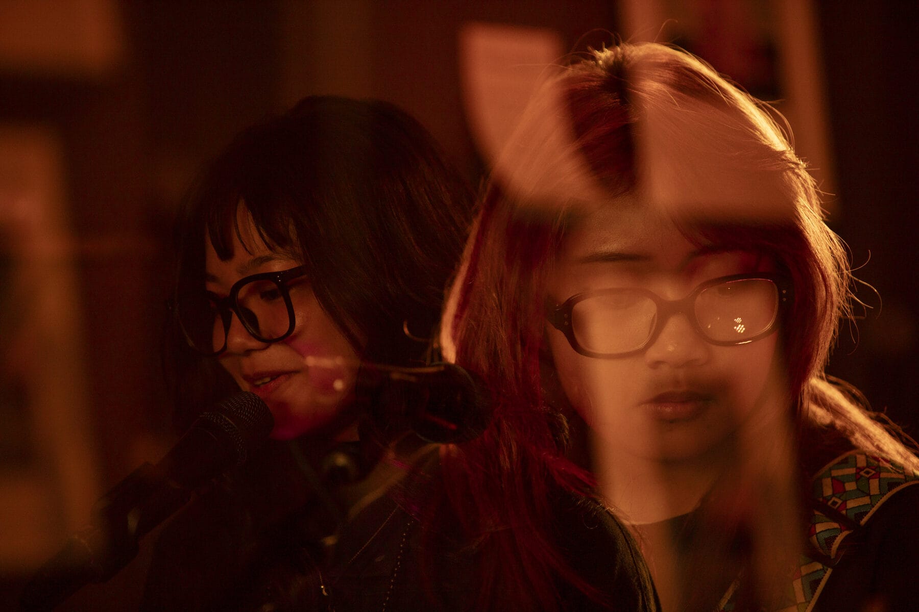 A duo performing in warm light